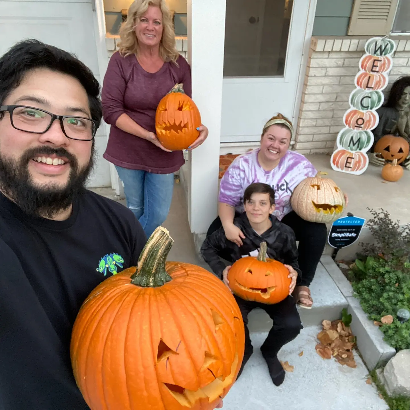 Sitting on the porch with our carved pumpkins